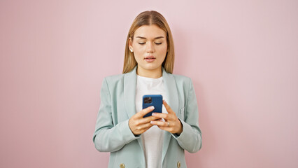 Wall Mural - Young blonde woman business worker talking on smartphone over isolated pink background