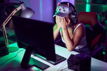 Canvas Print - Young beautiful hispanic woman streamer stressed using computer at gaming room