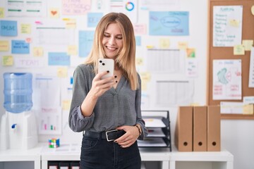 Poster - Young blonde woman business worker smiling confident using smartphone at office