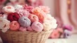 Basket is made of woven straw and is filled with yarn balls for knitting in various shades of pink, red, purple. The yarn balls are arranged neatly in the basket and have a soft and cozy texture