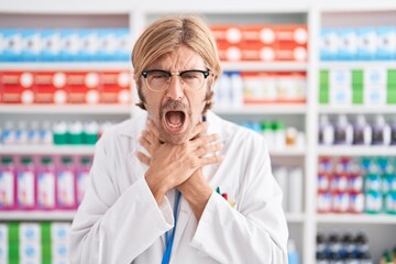 Canvas Print - Caucasian man with mustache working at pharmacy drugstore shouting and suffocate because painful strangle. health problem. asphyxiate and suicide concept.