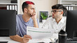 Two men business workers reading document working at office