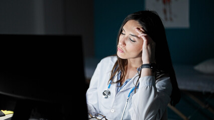 Sticker - Young beautiful hispanic woman doctor stressed working at clinic