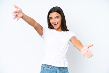 Wall Mural - Young caucasian woman isolated on white background presenting and inviting to come with hand