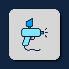 Sticker - Filled outline Paint spray gun icon isolated on blue background. Vector