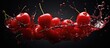 Red cherries and juice splash on black background Copy space image Place for adding text or design