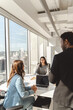 © Maria Vitkovska - Confident successful colleagues talking, planning startup, reading contract
