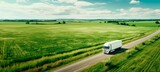 Fototapeta Natura -  A White Truck Drives Through  Green Hills and Forests, Symbolizing Sustainable Transportation Eco-Friendly Journey: horizontal background, copy space for text 