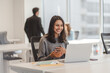 © Maria Vitkovska - Smiling indian business woman having laptop video call, working online from modern office