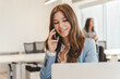 © Maria Vitkovska - Beautiful confident businesswoman talking on mobile phone looking away
