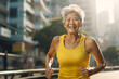Active elderly gray-haired Asian woman on a morning jog in the city