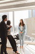 © Maria Vitkovska - Business people and smiling scrum master talking, explaining something using sticky notes