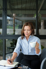 Wall Mural - Female calculating personal financial for future plan at her home, taxes payment