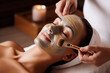 Beautiful woman treatment mask on face in spa center