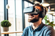 Excited man watching headset VR virtual reality in office
