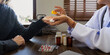 © Natee Meepian - Senior woman doctor recommend pill medical prescription to woman patient