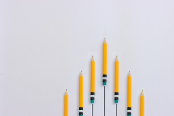 Wall Mural - Top view image of pencils on white textured paper