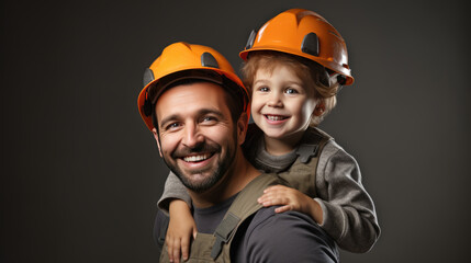 Canvas Print - Father is giving a piggyback ride to his delighted young child who is wearing a safety hard hat.