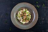 Fototapeta  - Italian cuisine - risotto with mushrooms. Cooked arborio rice with parmesan cheese and mushrooms