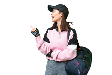 Wall Mural - Young sport woman with sport bag over isolated chroma key background pointing finger to the side and presenting a product