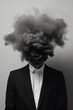 Man in black suit vanishing in a dark black smoke from head, surreal emotional concept.