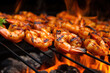 hot grilled shrimps skewers on the grid