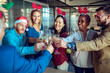 © Marko Geber - Business people drinking champagne during new year and Christmas holidays at the office