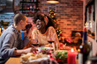© Marko Geber - Intimate Holiday Dinner with a Loving Lesbian Couple Enjoying Wine
