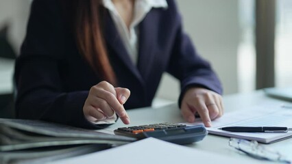 Wall Mural - Business woman analyzing data paperwork calculating numbers..