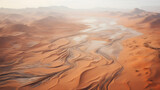 Vast desert landscape with dune patterns, bird's-eye view