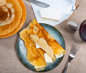 Canvas Print - Service plate containing fried hotcakes and brie cheese with other table appointments