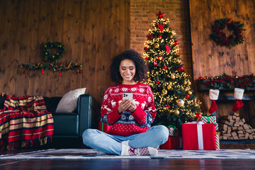 Sticker - Photo of attractive cute lady sitting on floor in own cozy decorated room writing sms magic holiday winter day indoors