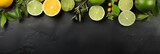 Fototapeta  - Top View of Limes Scattered on Slate Banner with Copyspace, Captured from Above.