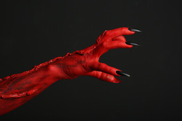 Wall Mural - Scary monster on black background, closeup of hand. Halloween character
