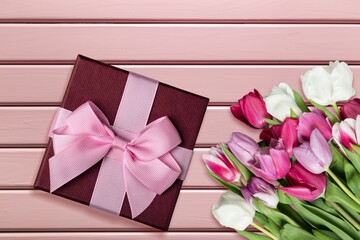 Wall Mural - Mother's Day concept. giftbox with bow and fresh bouquet
