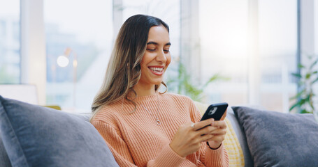 Canvas Print - Woman, living room sofa and texting with phone, smile and click for contact, meme and notification in home. Girl, smartphone and happy with click, reading and app for social media, video and relax