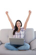 © vectorfusionart - Digital png photo of happy caucasian woman with laptop, raising arms on transparent background