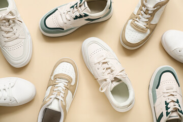 Wall Mural - Different stylish sneakers on beige background