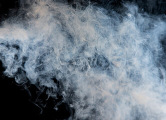 Wall Mural - gray smoke on a black background.