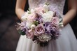 Bride holding a delicate bouquet of pastel flowers, symbolizing grace and wedding festivity.