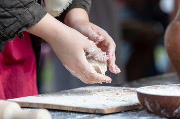 Sticker - A woman kneads the dough with her hands