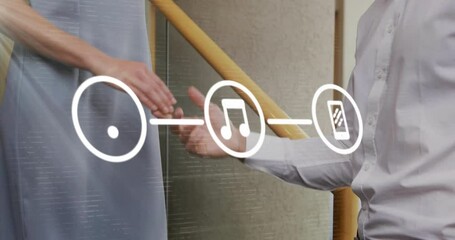Poster - Animation of flowchart of icons over caucasian woman walking downstairs and shaking hands with man