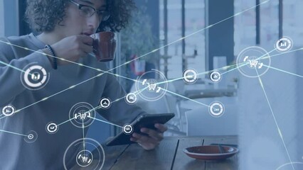Poster - Animation of connected icons over biracial man scrolling on digital tablet while drinking coffee
