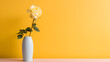 Single yellow rose in a white vase on a yellow background.