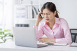 © David - Tired exhausted or sad business young asian woman sleepy and bored from sitting at a desk.tired of working in a laptop,