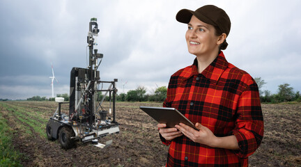 Fototapete - Autonomous robot for measuring soil quality in an agricultural field. Wind turbine on a horizon. Smart farming concept