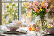 An artistically arranged Easter brunch table with pastel linens and spring flowers.