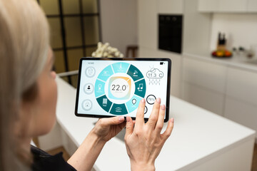 Poster - Smart home control on tablet. Interior of living room in the background