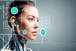 © ismael - Close up of a female robot looking at the virtual projection of a network.IA generativa