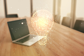 Poster - Creative light bulb hologram on modern laptop background, idea concept. Multiexposure